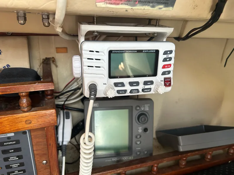 VHF radio and navigation equipment inside a 1981 Catalina 30 sailboat cabin.