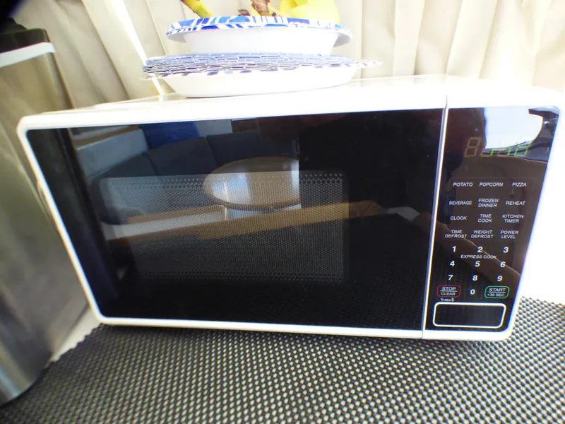 Microwave oven on Lagoon 380 catamaran, 2015 model, with digital control panel.