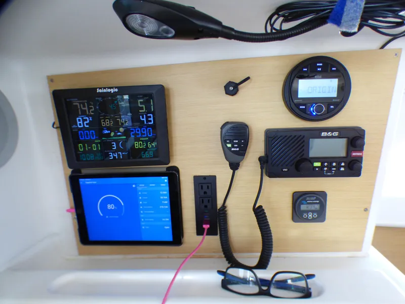 Control panel of a 2015 Lagoon 380 catamaran with navigation and communication equipment.