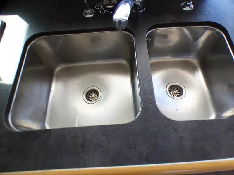 Stainless steel double sink on Lagoon 380 catamaran, 2015 model.