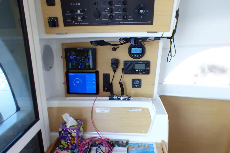 Control panel of a 2015 Lagoon 380 catamaran with navigation and communication equipment.