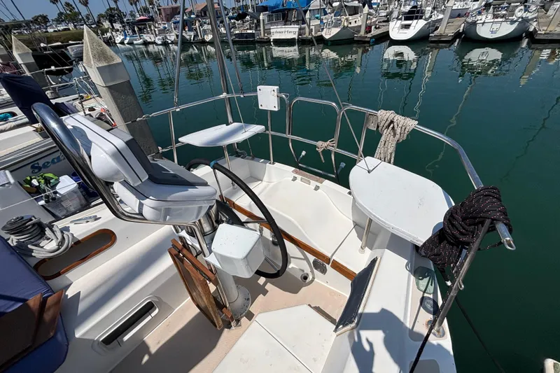 Cockpit of a 1987 Catalina 34 sailboat docked in a marina.