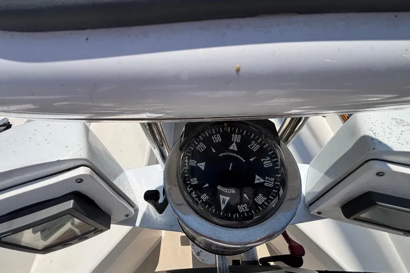 Compass and navigation instruments on a 1987 Catalina 34 sailboat.