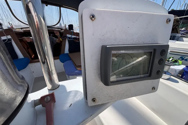 Catalina 34 sailboat cockpit with Raymarine navigation display, 1987 model.