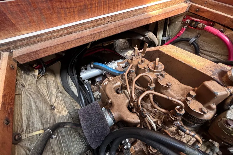 Engine compartment of a 1987 Catalina 34 sailboat, showing detailed mechanical components.