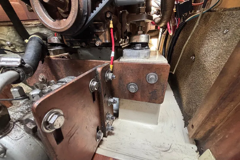 Engine compartment of a 1987 Catalina 34 sailboat, showing detailed mechanical components.