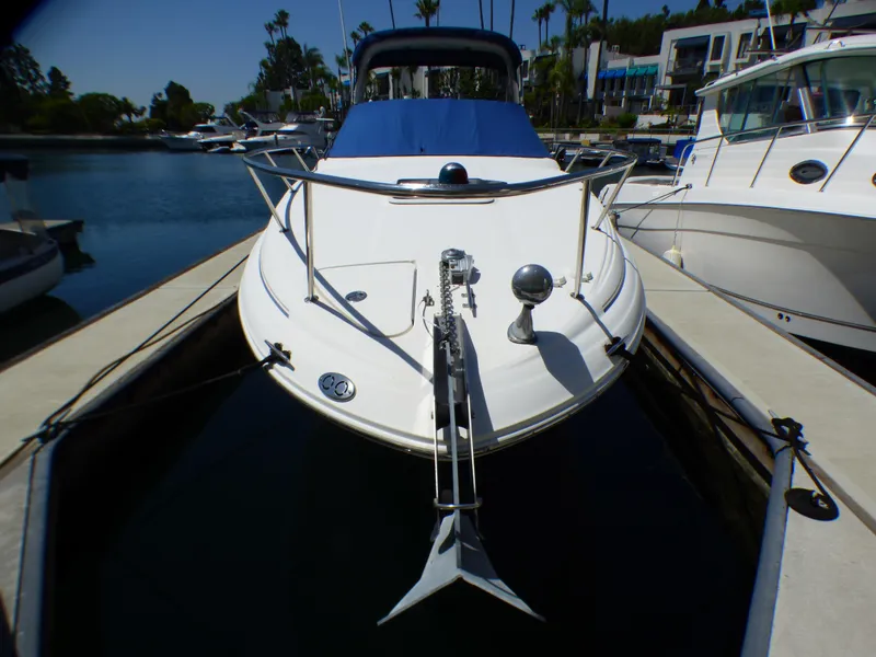 2003 Sea Ray 260 Sundancer docked at marina, front view.
