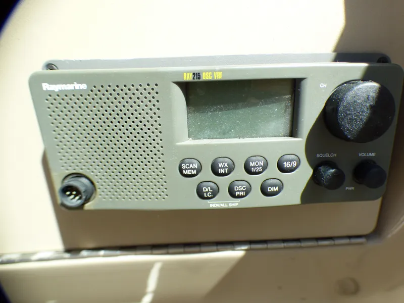 Raymarine marine radio on 2003 Sea Ray 260 Sundancer boat dashboard.