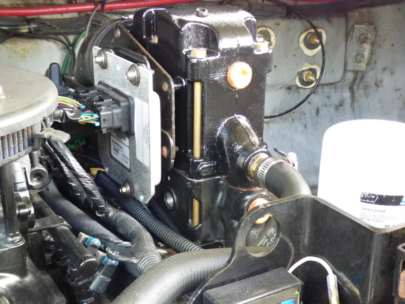 Engine compartment of a 2003 Sea Ray 260 Sundancer boat, showing mechanical components and wiring.