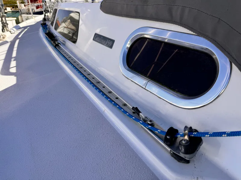Catalina 350 sailboat deck with blue rope and window, 2004 model.