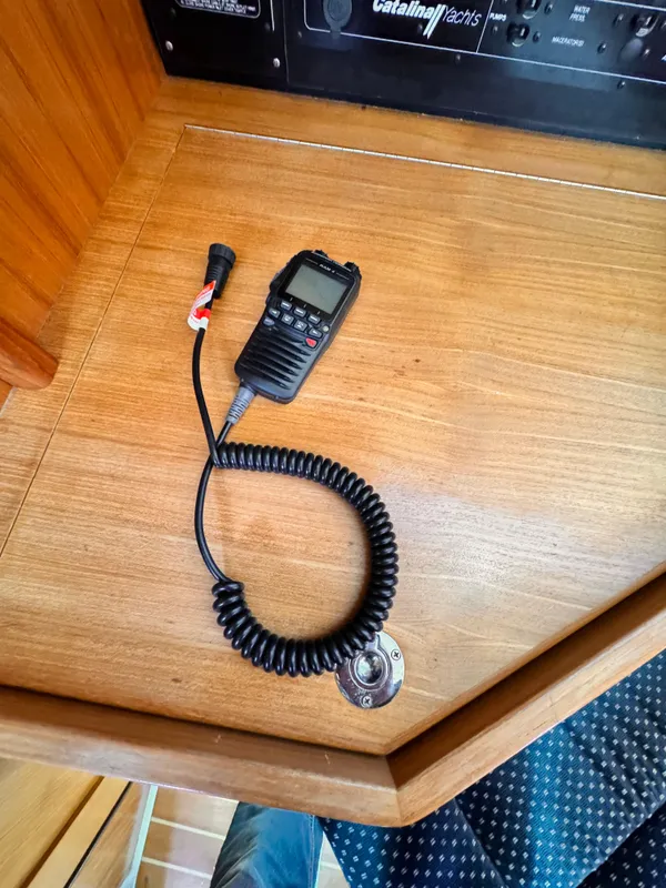 VHF radio handset on Catalina 350 yacht's wooden navigation station, 2004 model.