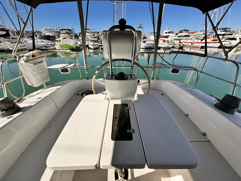 Cockpit view of 2004 Catalina 350 sailboat docked in a marina.