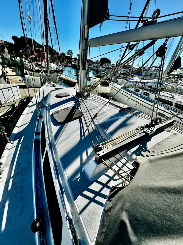 2004 Catalina 350 sailboat deck with rigging in a marina setting.