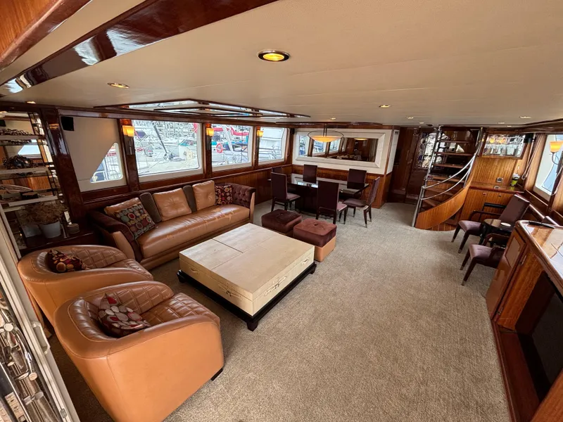 Luxurious interior of 2010 Norseman 80 yacht with leather seating and elegant dining area.