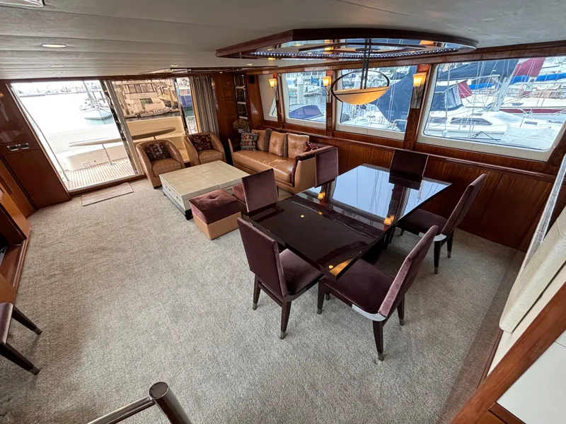 Luxurious interior of 2010 Norseman 80 yacht with elegant dining and seating area.