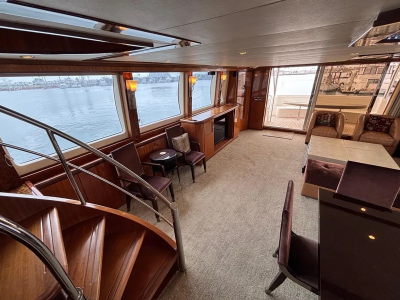Luxurious interior of 2010 Norseman 80 yacht with elegant seating and panoramic windows.