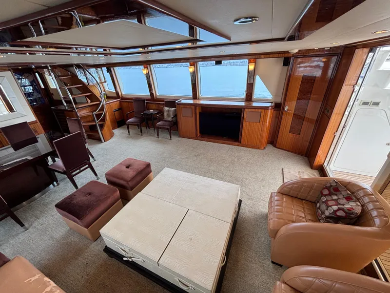 Luxurious interior of 2010 Norseman 80 yacht with elegant seating and panoramic windows.