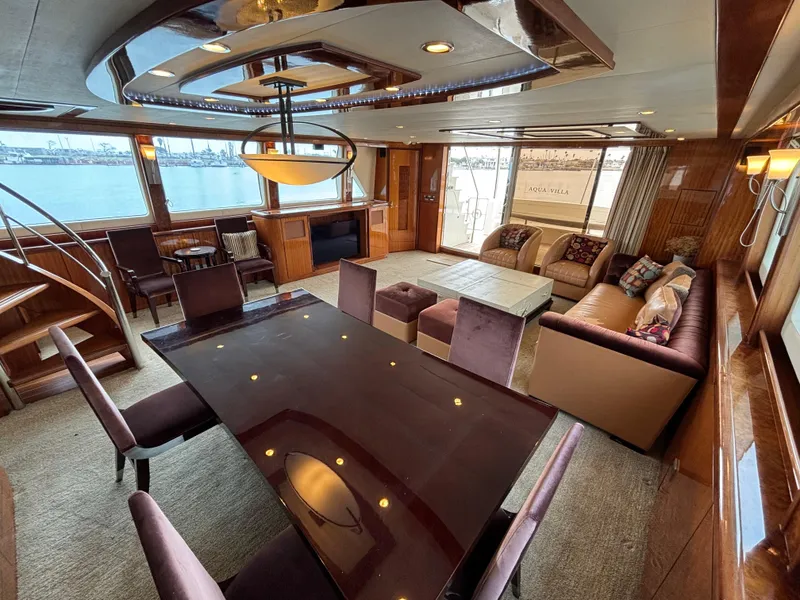 Luxurious interior of 2010 Norseman 80 yacht with elegant dining and seating area.