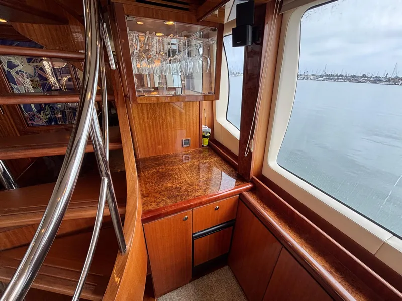Luxurious Norseman 80 yacht interior with wooden cabinetry and ocean view, 2010 model.