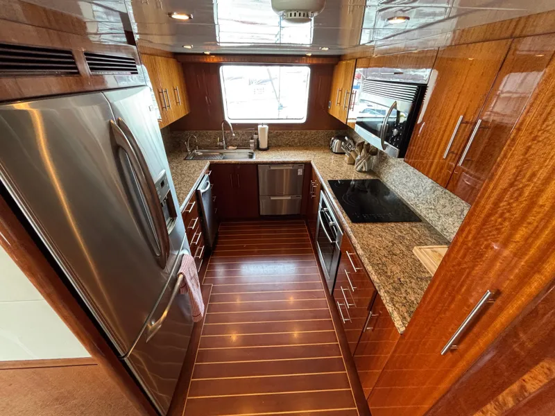 Luxurious Norseman 80 yacht kitchen with granite countertops and stainless steel appliances, 2010 model.