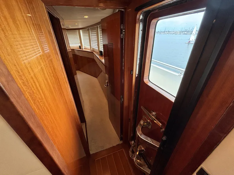 Interior view of 2010 Norseman 80 yacht with wooden finishes and ocean view.
