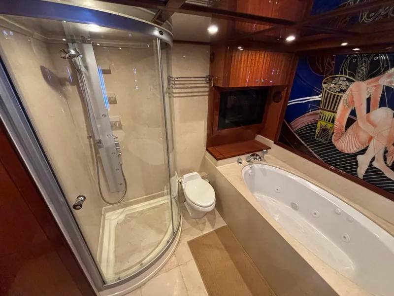 Luxurious bathroom in 2010 Norseman 80 yacht with shower and jacuzzi tub.