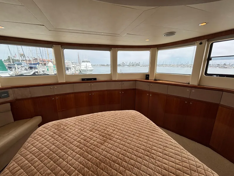 Luxurious Norseman 80 yacht interior with panoramic windows and elegant wood cabinetry, 2010 model.