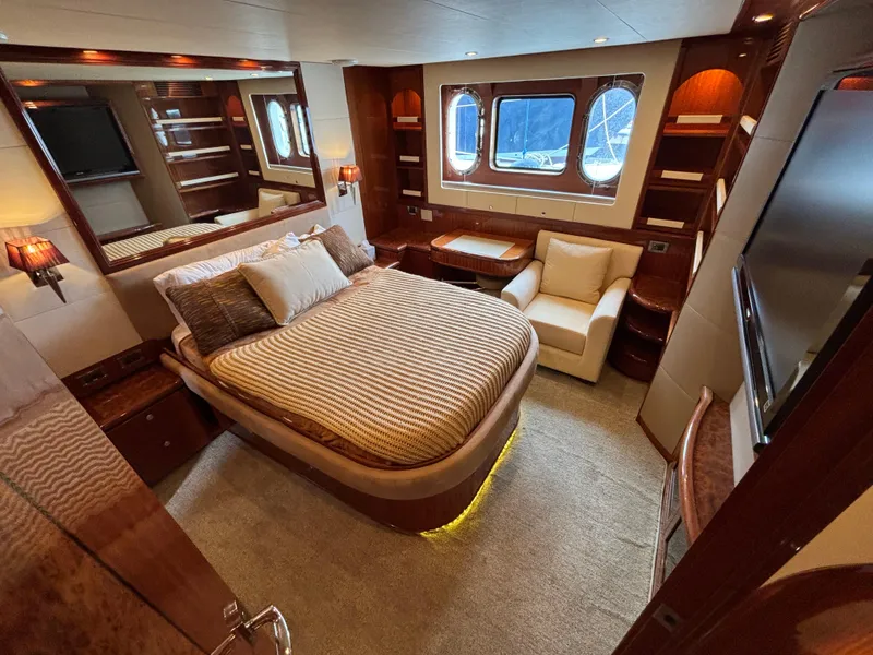 Luxurious Norseman 80 yacht bedroom with elegant wood finishes and large windows, 2010 model.