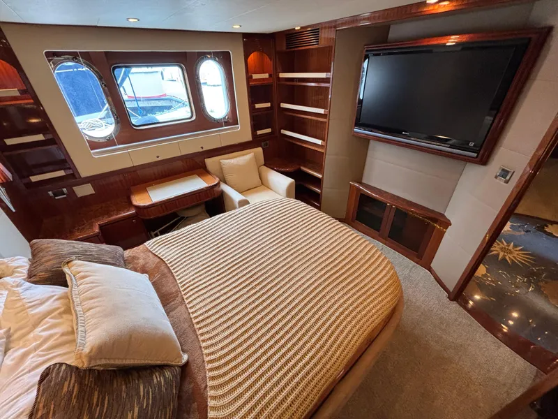 Luxurious Norseman 80 yacht bedroom with elegant wood finishes and large windows, 2010 model.