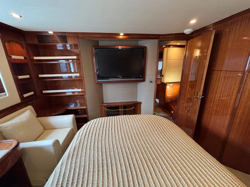 Luxurious Norseman 80 yacht interior, featuring elegant wood finishes and a cozy seating area.
