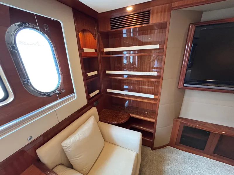 Luxurious Norseman 80 yacht interior with wood paneling, window, and seating, 2010 model.