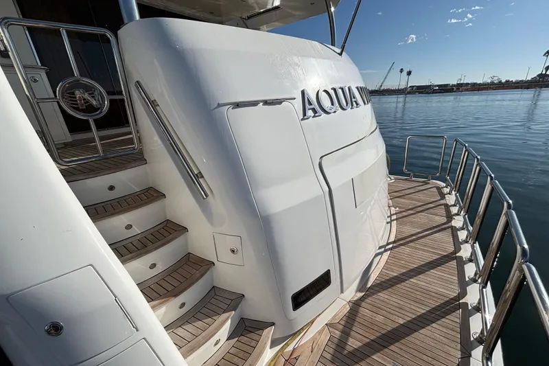Luxury yacht Norseman 80, 2010 model, with elegant deck and staircase.