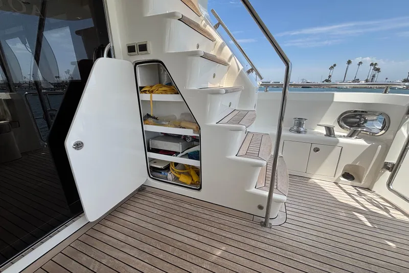 Norseman 80 yacht deck with open storage, stairs, and ocean view, 2010 model.