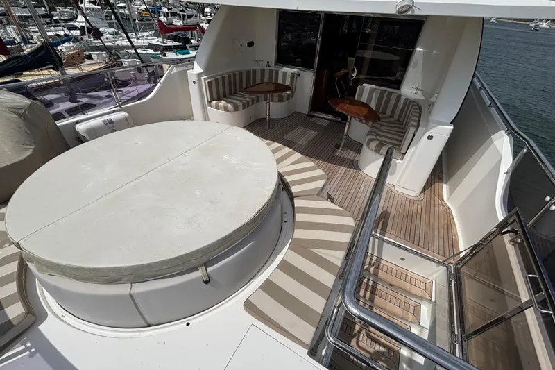 Luxurious 2010 Norseman 80 yacht deck with seating and covered hot tub.