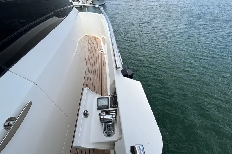 Side deck of 2010 Norseman 80 yacht with control panel, overlooking water.