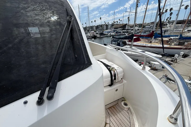 2010 Norseman 80 yacht docked at marina with lifeboat and clear sky.