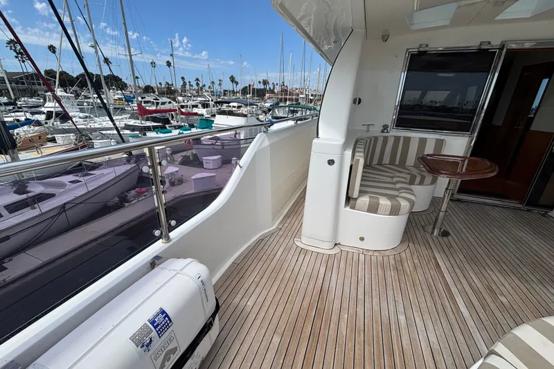 Luxurious 2010 Norseman 80 yacht deck with seating, docked at a marina.