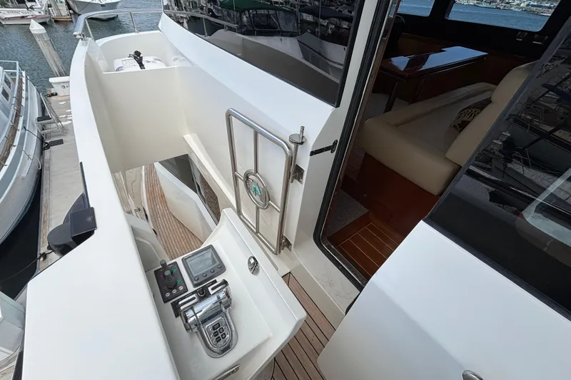 2010 Norseman 80 yacht deck with control panel and open cabin door.