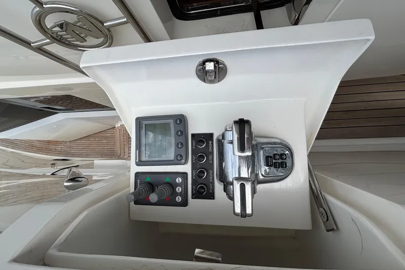Control panel of a 2010 Norseman 80 yacht with navigation and throttle controls.