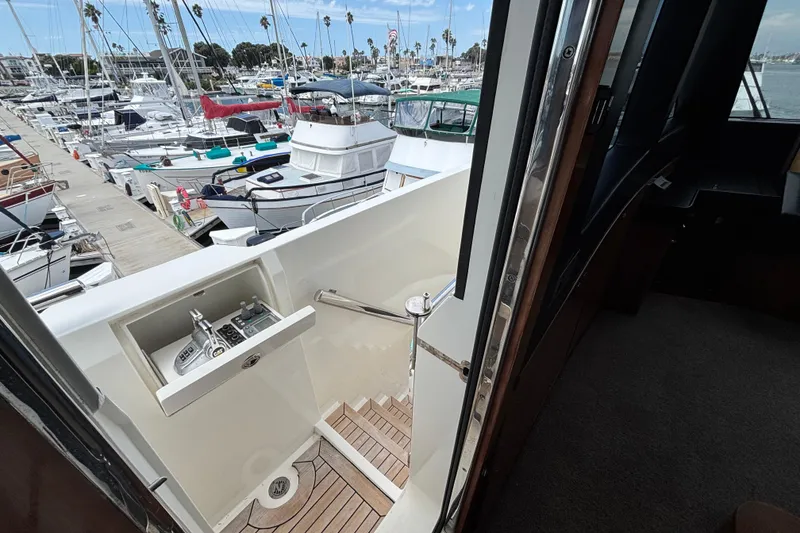 Norseman 80 yacht, 2010 model, docked at marina with visible control panel and stairs.