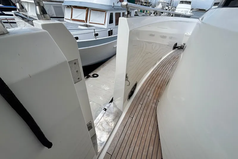 Norseman 80 yacht deck, 2010 model, docked alongside other boats.