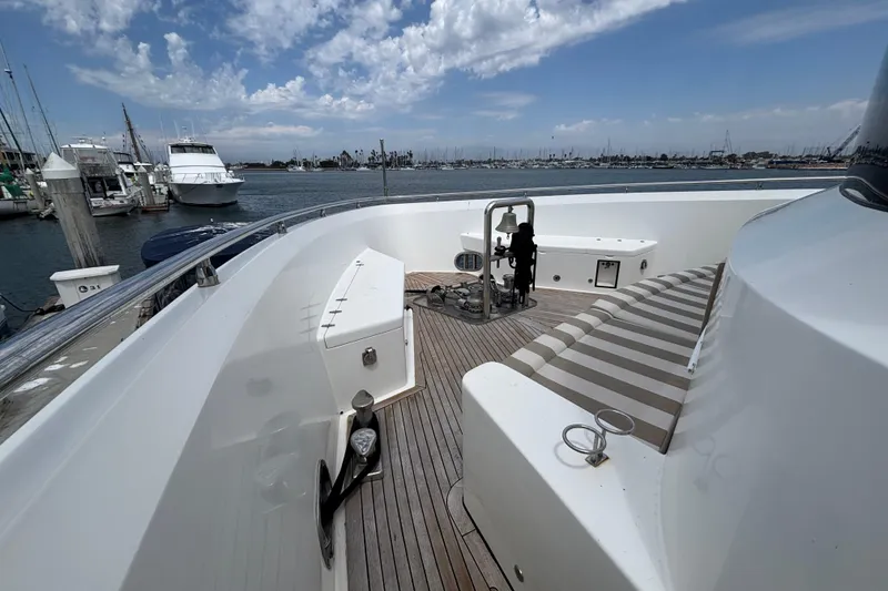 Deck view of 2010 Norseman 80 yacht docked at marina under cloudy sky.