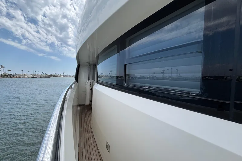 Side view of 2010 Norseman 80 yacht with ocean and sky reflection.