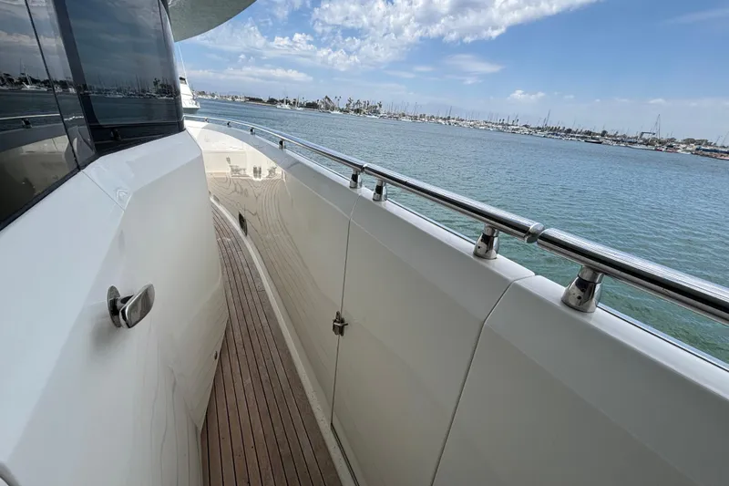 Side deck of 2010 Norseman 80 yacht with ocean view and clear sky.