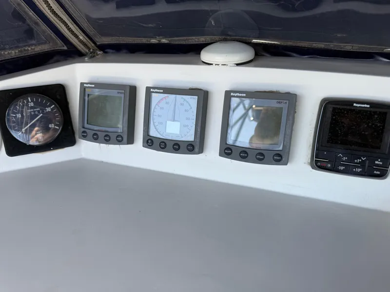 Control panel of a 1985 Nauticat 43 sailboat with Raytheon instruments.