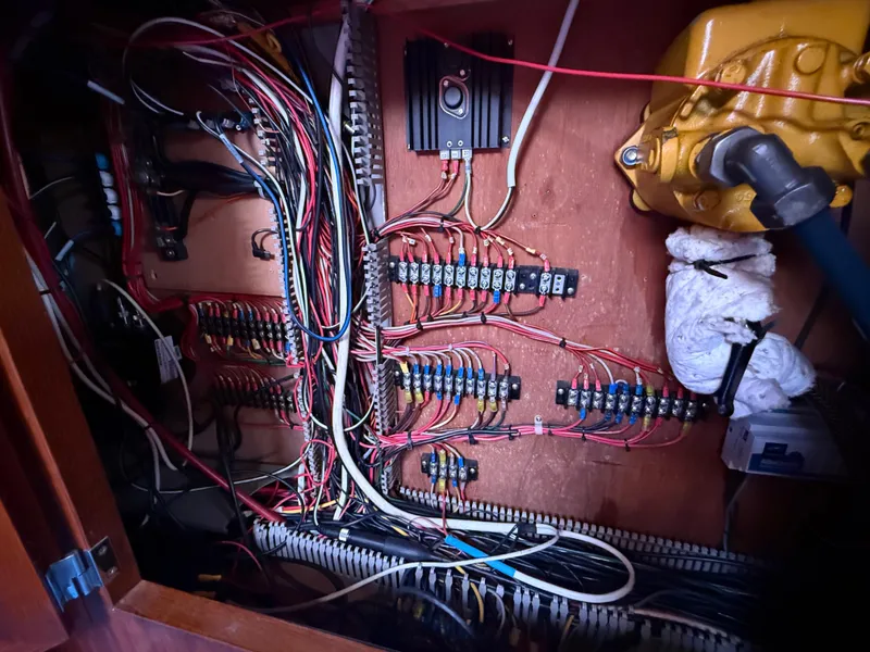 Electrical wiring system inside a 1985 Nauticat 43 boat, showcasing complex cable arrangement.