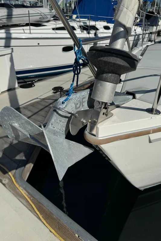 1989 Catalina Sloop sailboat with anchor at marina dock.