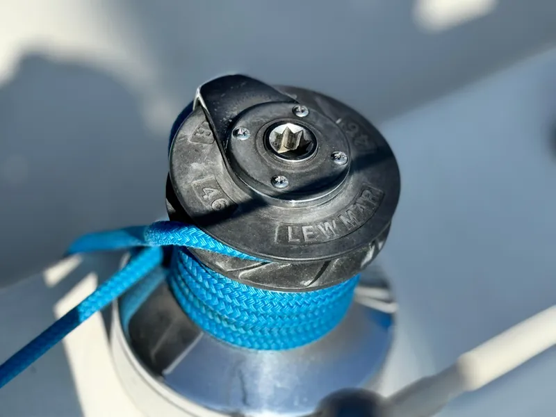 Close-up of a Lewmar winch with blue rope on a 1989 Catalina Sloop.