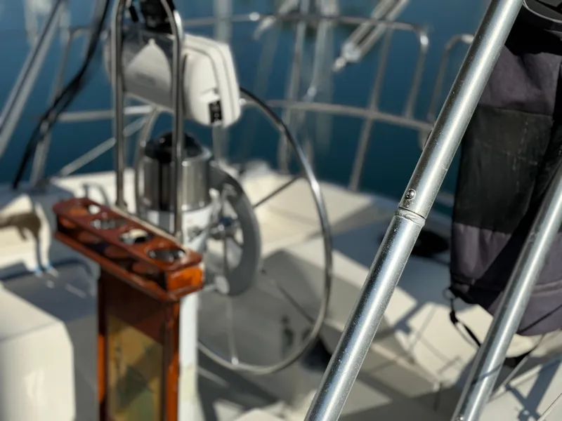 1989 Catalina Sloop cockpit with steering wheel and railing details.