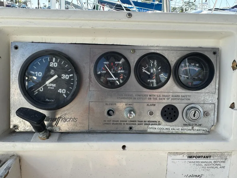 Instrument panel of a 1989 Catalina Sloop yacht with RPM, temperature, fuel, and oil gauges.